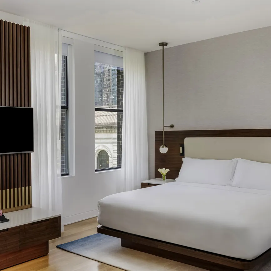 Junior Suite Park View bedroom during the day, alternate view