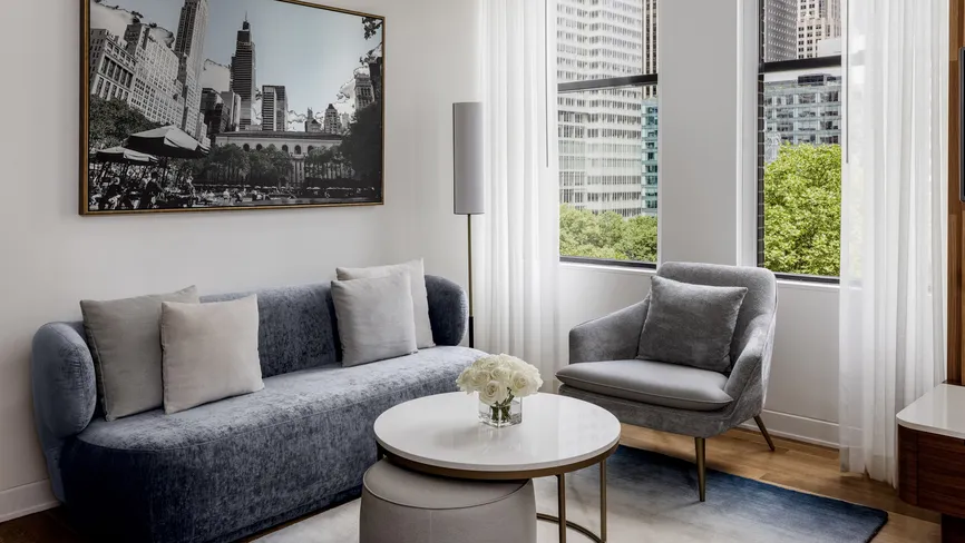 Junior Suite Park View living room with sofa and artwork