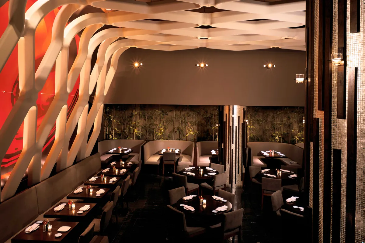 Koi restaurant main dining room with sculptural ceiling and banquette tables