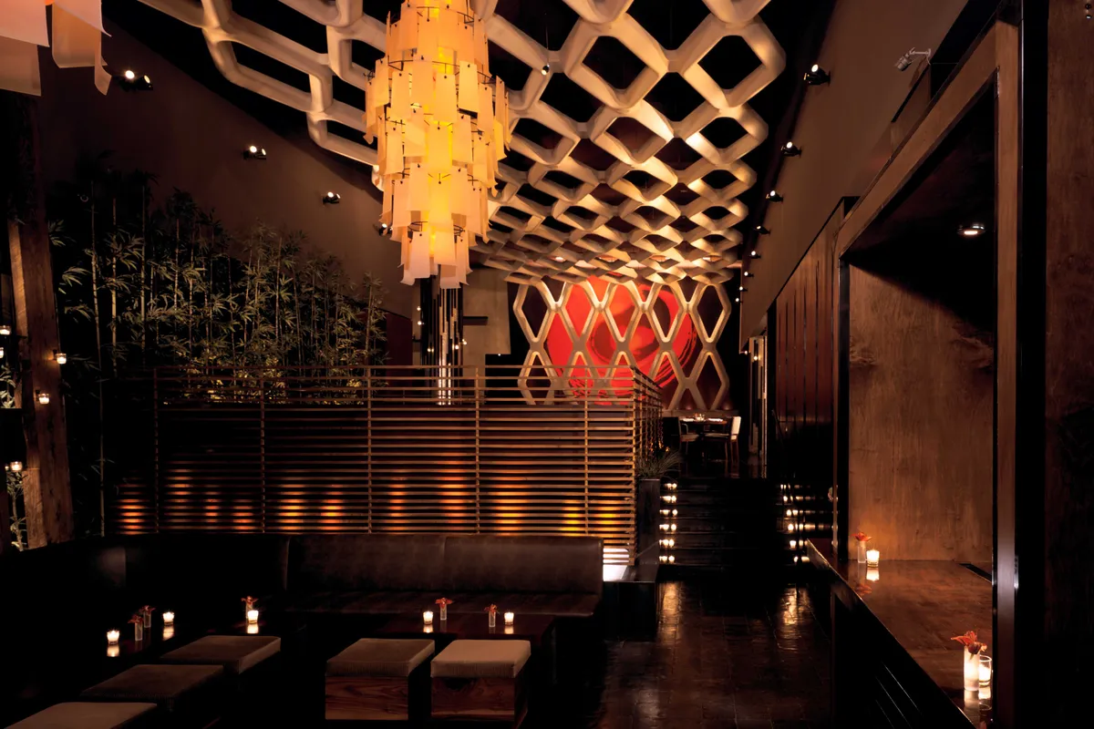 Koi restaurant lounge with lattice ceiling, chandelier and low seating