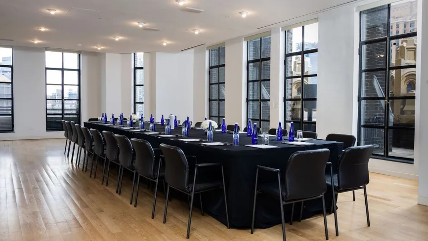 Conference Room set up U-shape with hardwood flooring