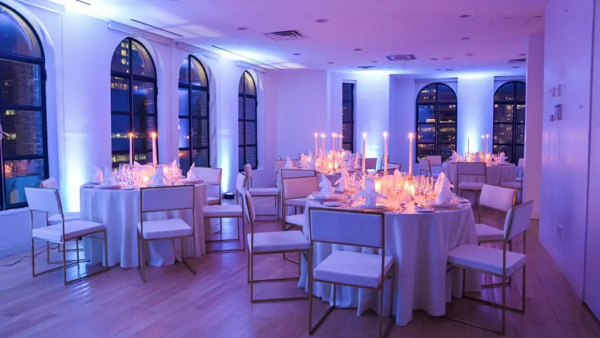 Conference Room set for a formal dinner with purple lighting