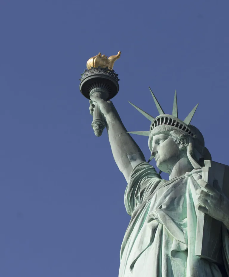 Statue of Liberty against a blue sky
