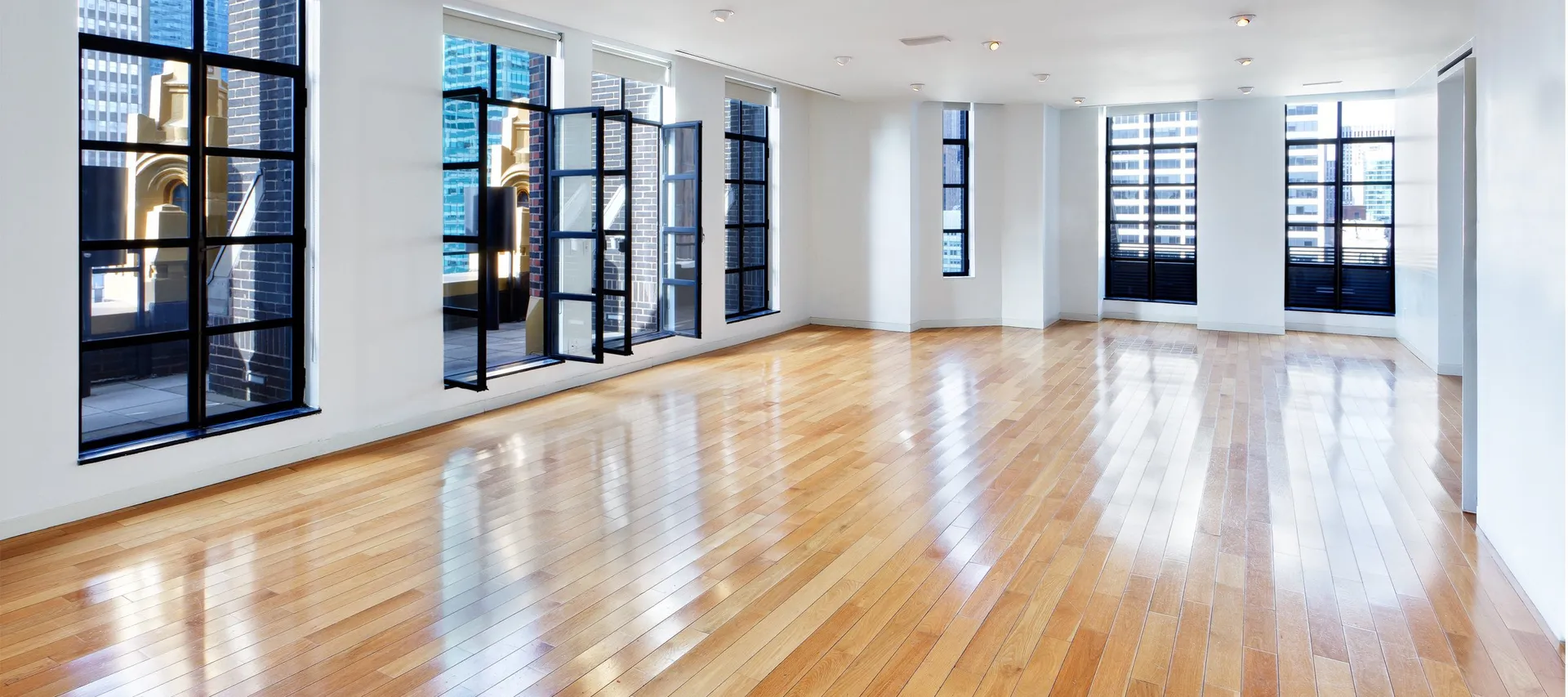 Terrace Loft event space with tall windows and hardwood floors