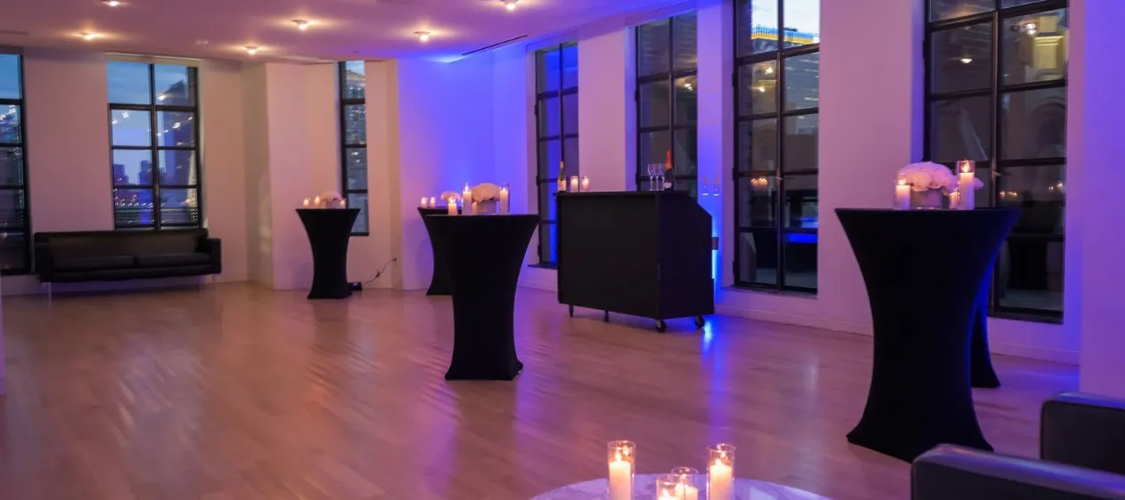 Conference Room set for a standing reception with purple lighting
