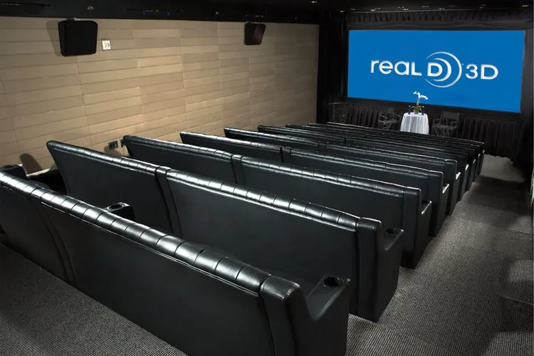 Screening Room with rows of leather theater seats facing a screen