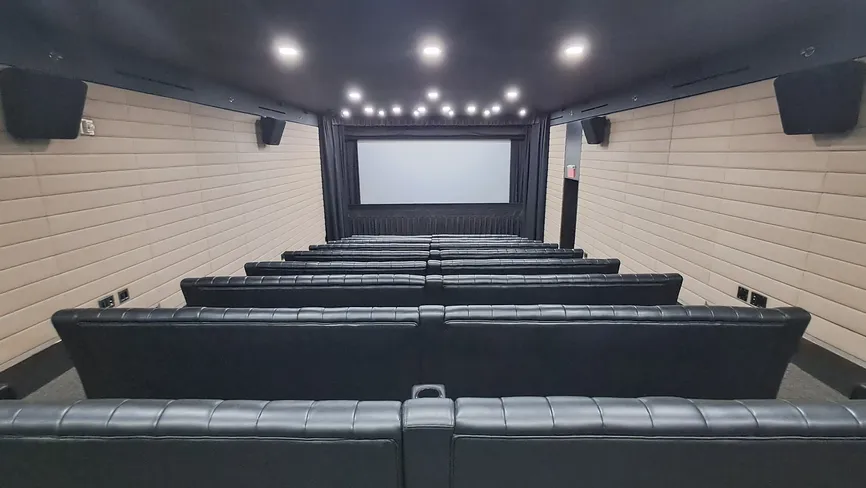 Screening Room theater seating facing the projection screen