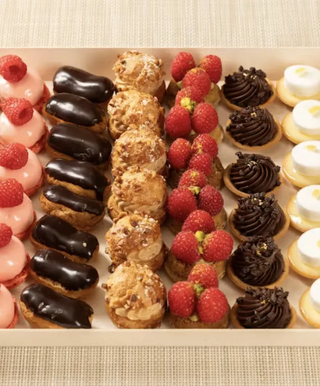 Assorted French pastries and macarons on a tray