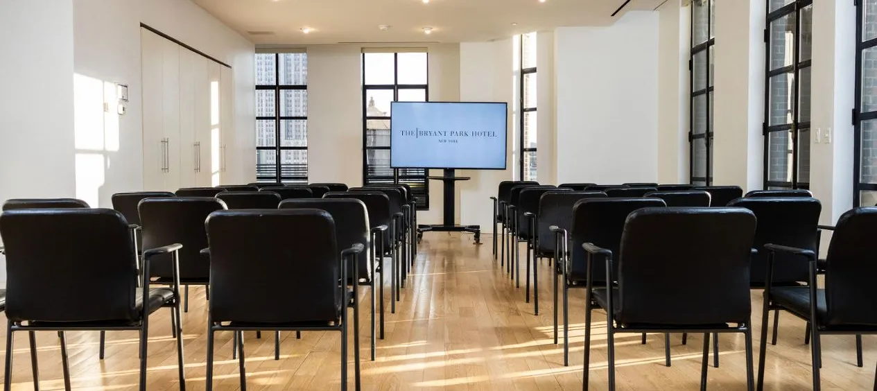 Conference Room set up classroom-style facing a screen