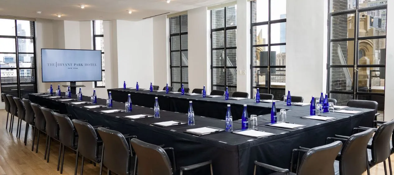 Conference Room set up boardroom-style with presentation screen