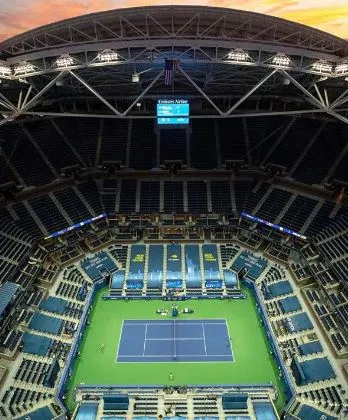 Arthur Ashe Stadium aerial view at dusk