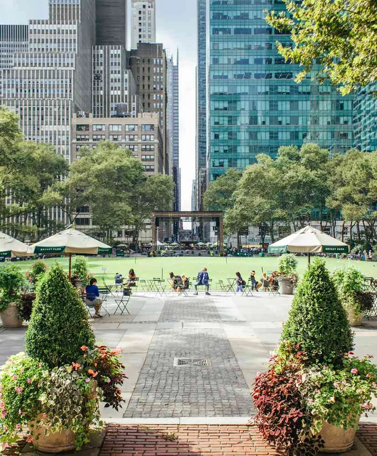 Bryant Park lawn and gardens with Midtown skyline
