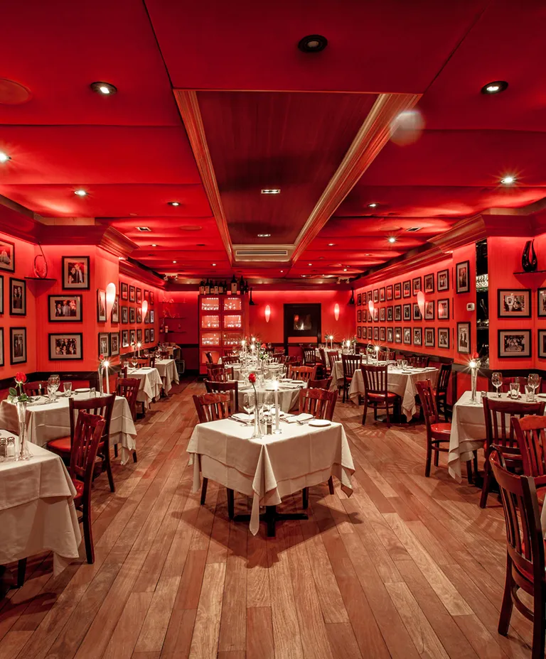 21 Club restaurant dining room with red walls