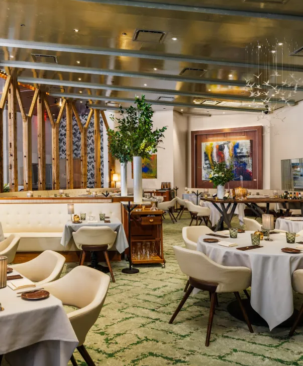 Elegant restaurant dining room with garden accents