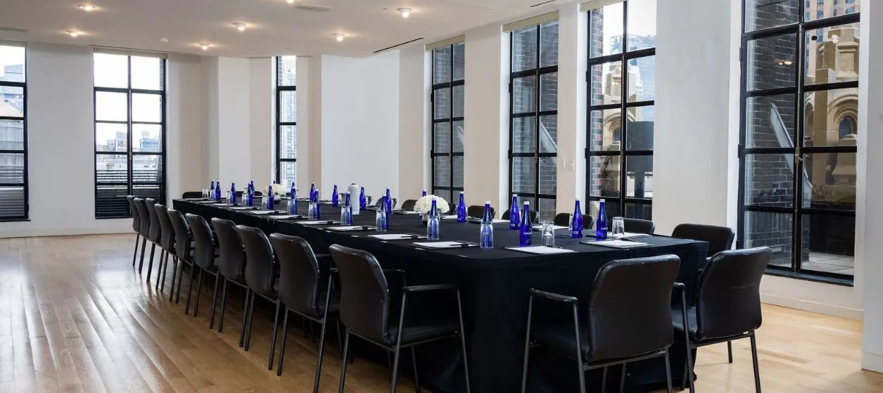 Conference Room set up boardroom-style with hardwood flooring